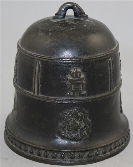 A Chinese or Japanese bronze small temple bell, 14cm